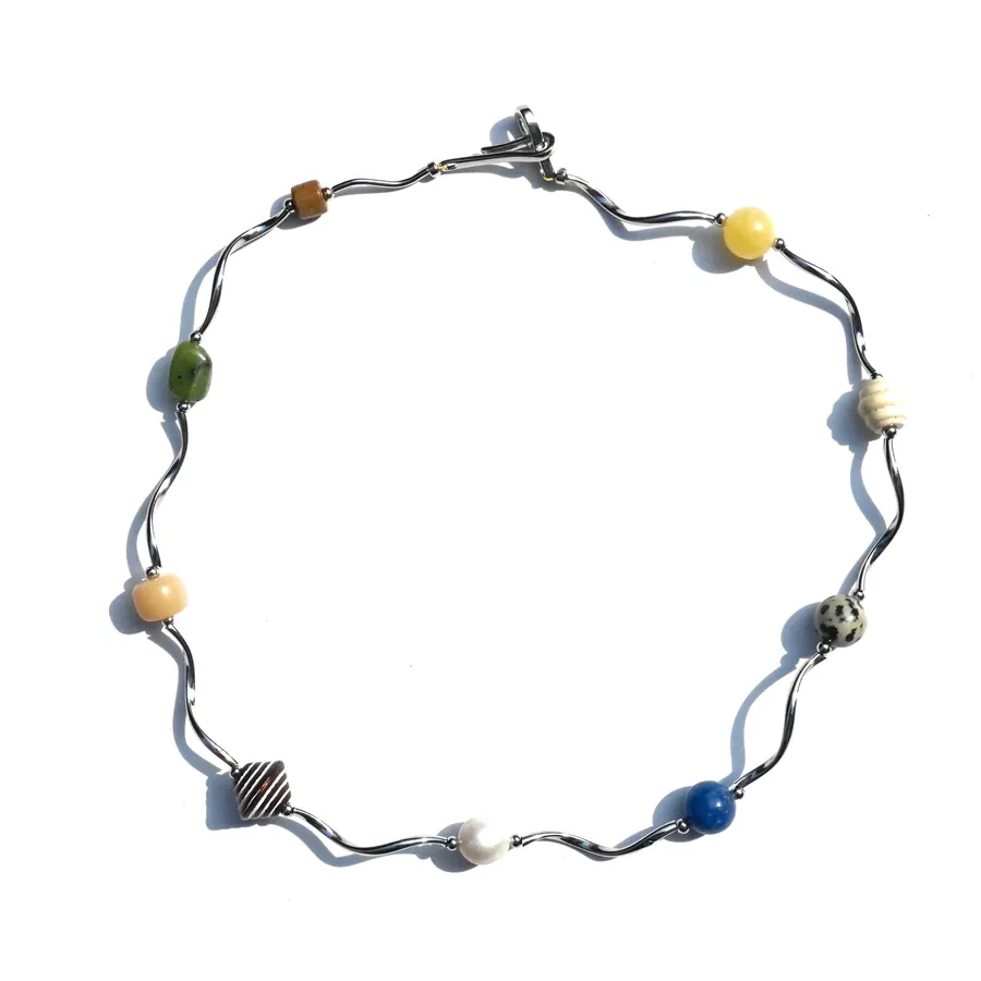 Handmade beaded stone necklace on a wavy wire